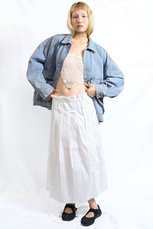 ASYMMETRIC BUTTON PLEATED SKIRT WHITE