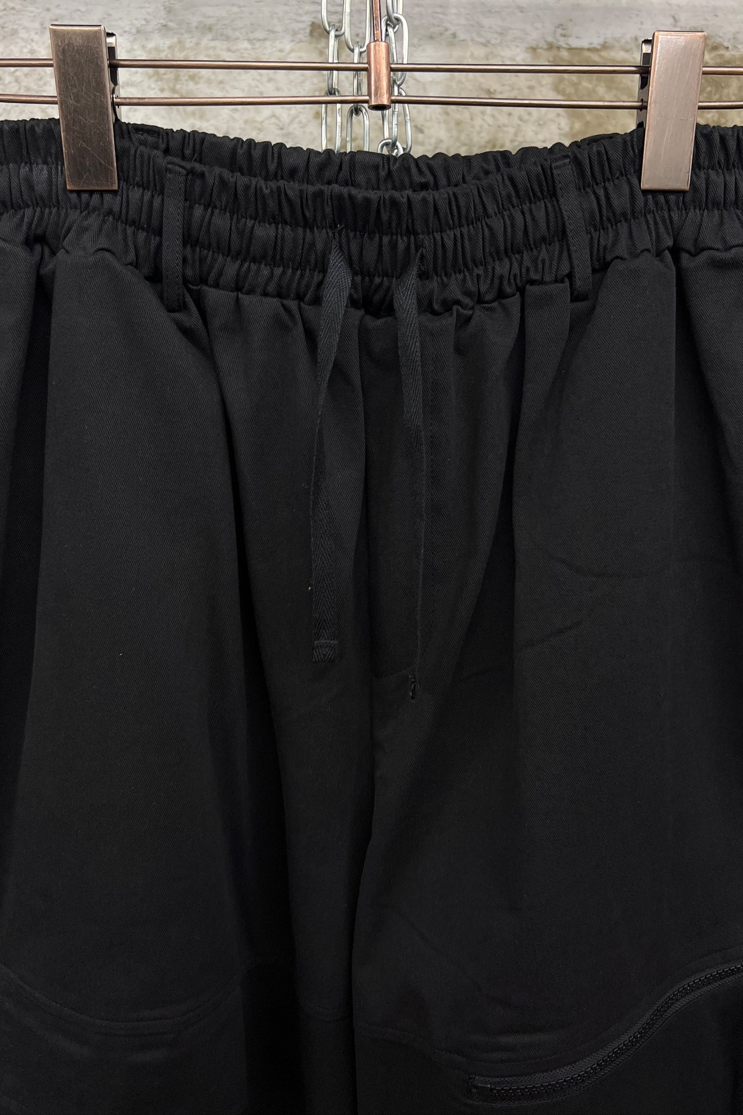 ASYMMETRIC POCKET WIDE-LEG TROUSERS