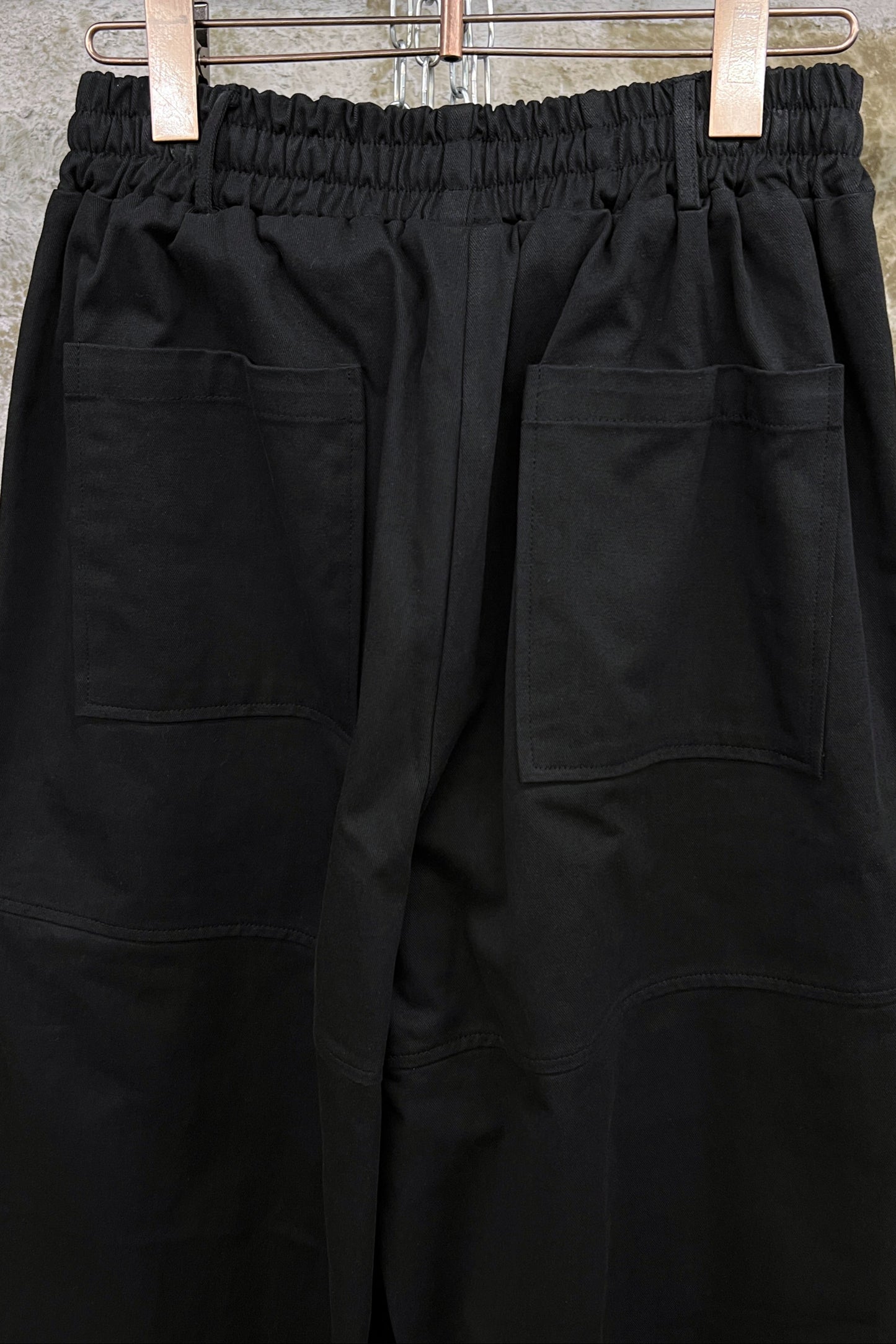 ASYMMETRIC POCKET WIDE-LEG TROUSERS
