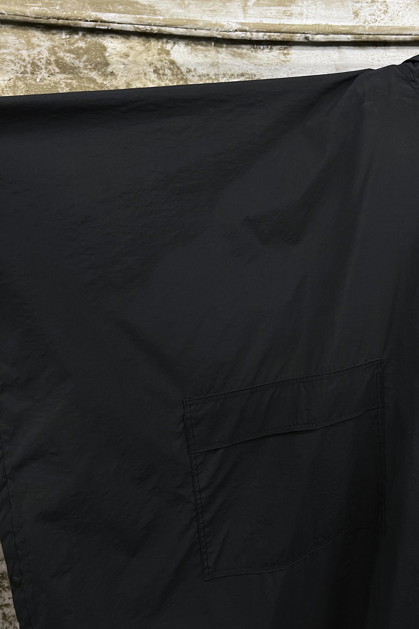 BLACK TECHNICAL NYLON HOODED CAPE